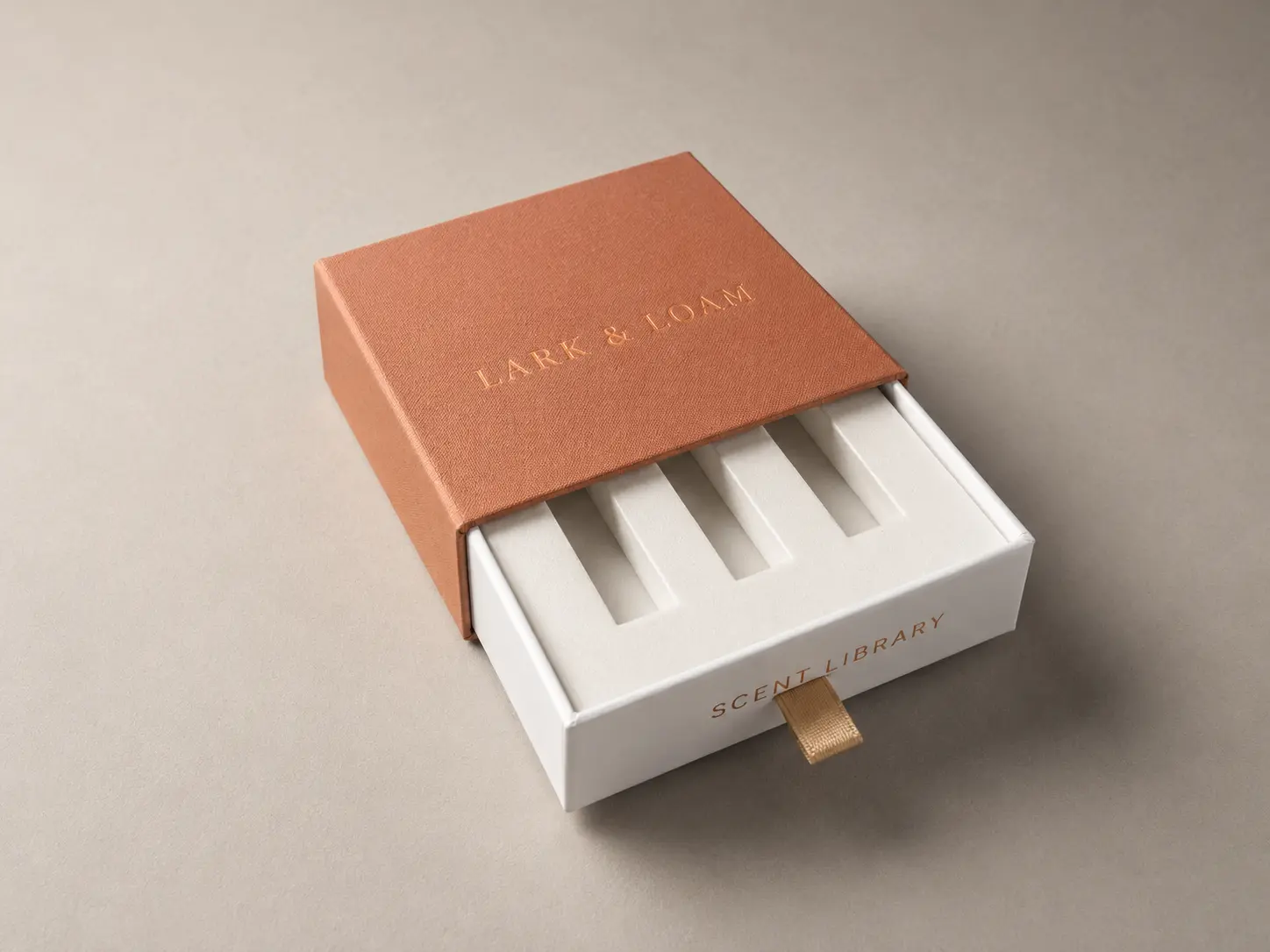 Digitally rebranded representative packaging concept illustrating drawer box with fitted insert